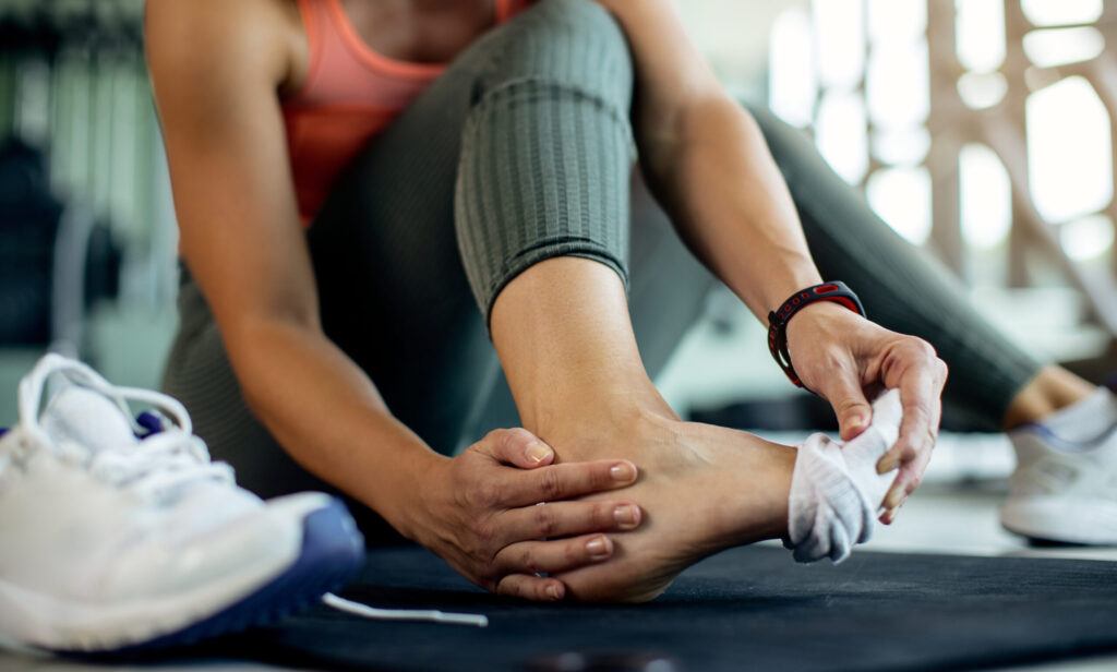 Copy of close up of athletic woman injured her foot during 2023 11 27 05 25 09 utc scaled e1728470821298